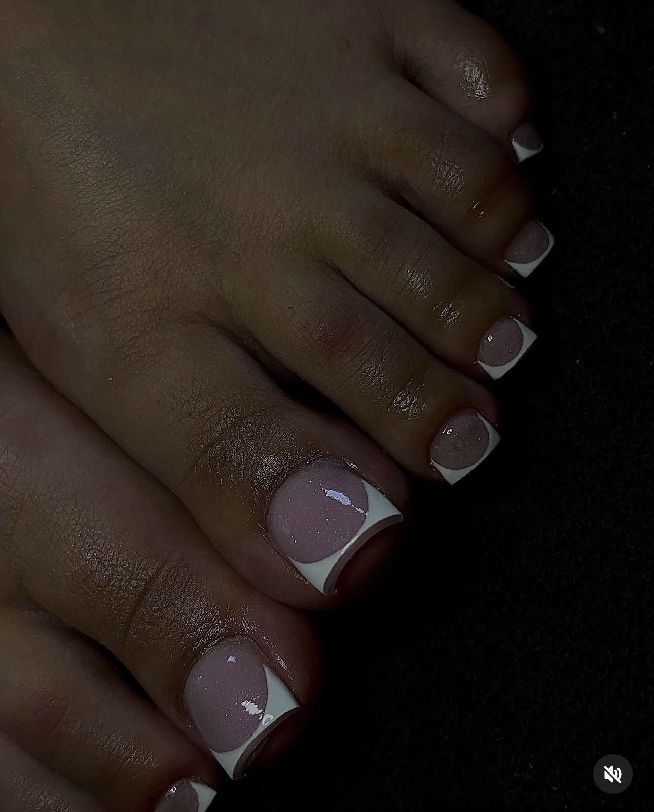 Soft pink French pedicure with white tips and glossy finish